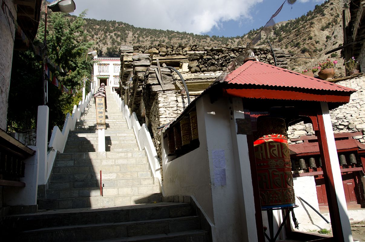 105 Marpha Tashi Lhakhang Gompa I visited Marpha's large impressive gompa, Tashi Lhakhang, which was renovated and enlarged in 1996. The gompa, as are all the buildings in Marpha, is painted with a whitewash that is produced from a special local stone